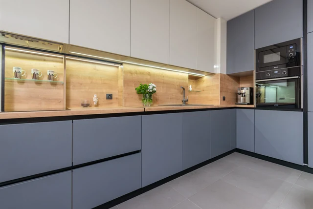 Anthracite kitchen ideas UK with handleless units and a wood worktop