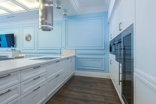 Duck egg blue kitchen ideas UK with pale blue panelled units and white walls
