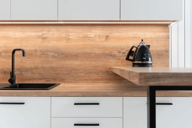 Laminate worktops UK shown as a wood-effect worktop with white units