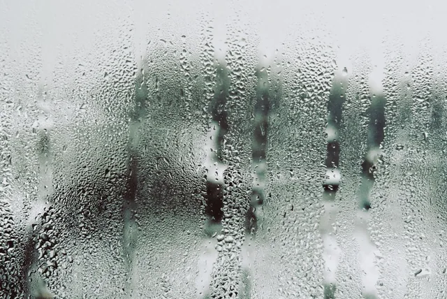 How to stop mould in bedroom UK shown by condensation on a window