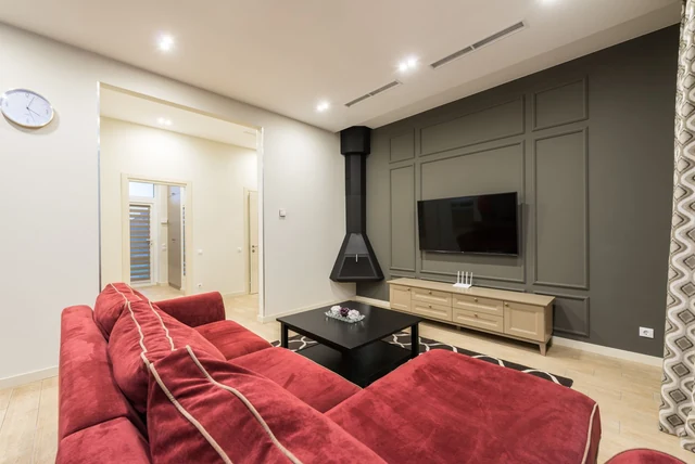 TV wall ideas living room with a wall-mounted TV on a panelled wall